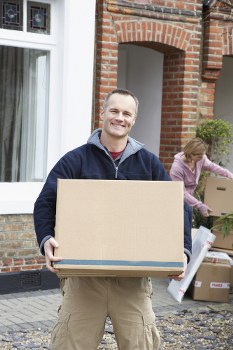 Professional moving team handling packed boxes in Ruislip