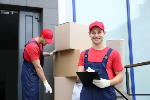 Business movers handling office equipment during a commercial move in Ruislip