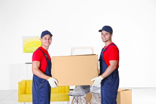 Specialist movers protecting a piano during a residential relocation in Ruislip