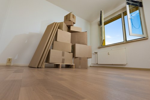 Experienced Ruislip moving professionals unloading boxes