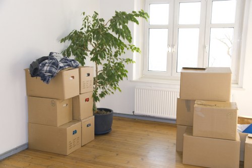 Removal van and packed boxes prepared for a booked move